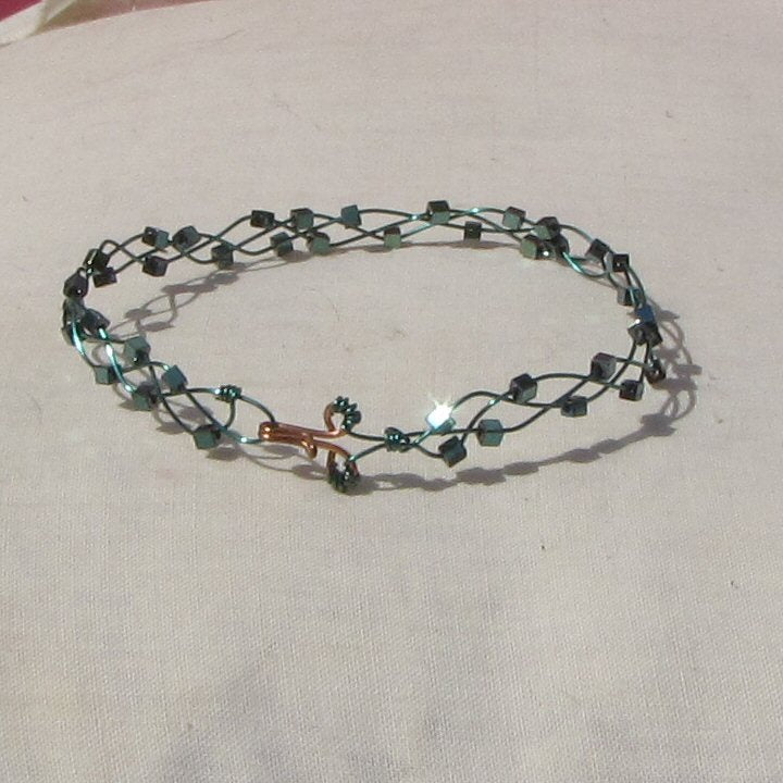 Sea-green coloured copper plaited bracelet with shiny mermaid green coloured hematite cubes