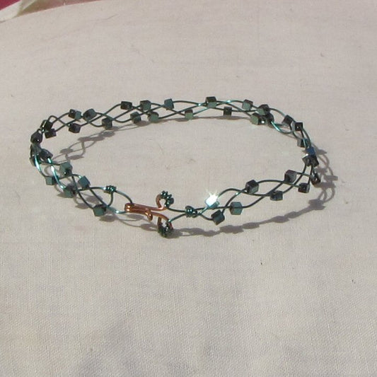 Sea-green coloured copper plaited bracelet with shiny mermaid green coloured hematite cubes