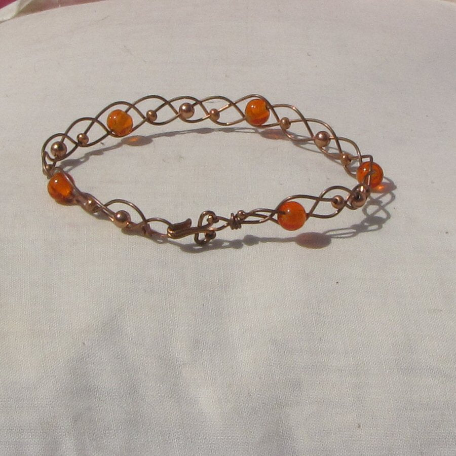 Copper and orange glass beads plaited bracelet - detail