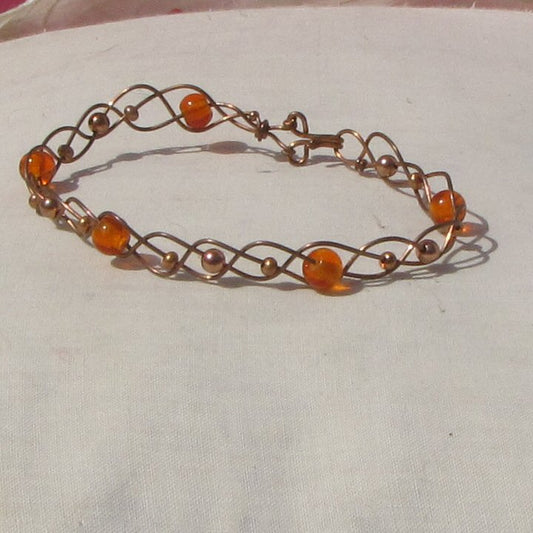 Copper and orange glass beads plaited bracelet