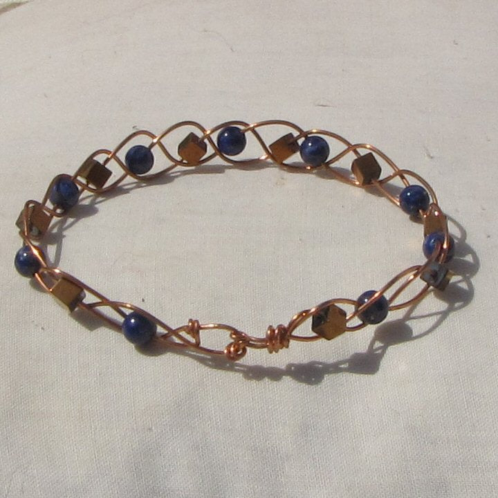 Copper plaited bracelet with lapis lazuli and copper hematite cubes