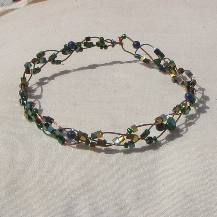 Copper and vivid green coloured copper plaited bracelet with lapis lazuli and a mixture of beads