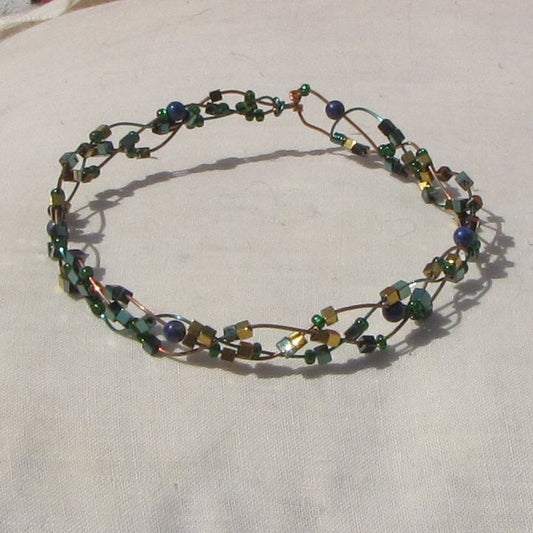 Copper and vivid green coloured copper plaited bracelet with lapis lazuli and a mixture of beads