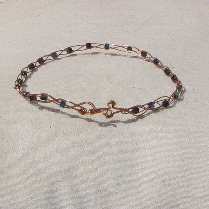 Copper plaited bracelet with shiny mermaid green, blue and purple coloured hematite cubes - detail