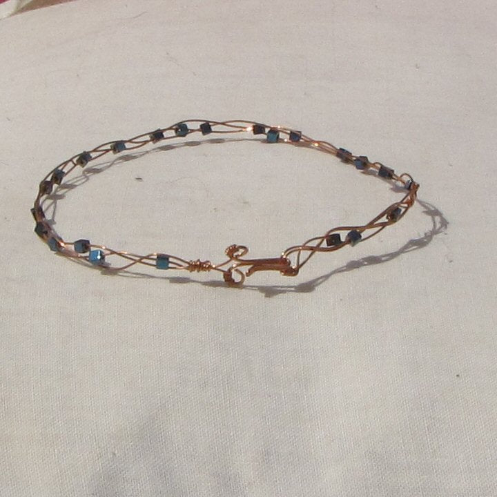 Delicate copper plaited bracelet with blue hematite cubes - detail