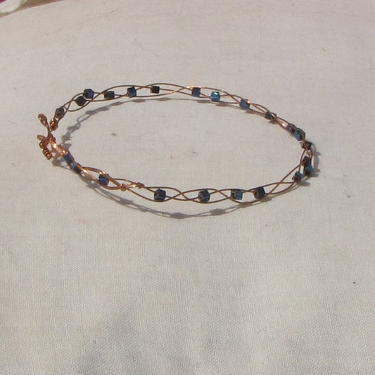 Delicate copper plaited bracelet with blue hematite cubes