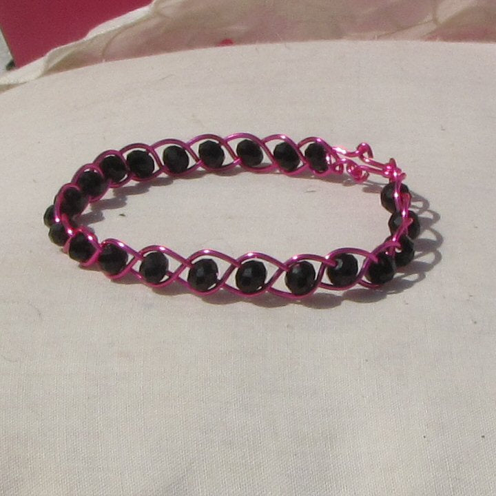 Hot shiny pink coloured copper plaited bracelet - detail