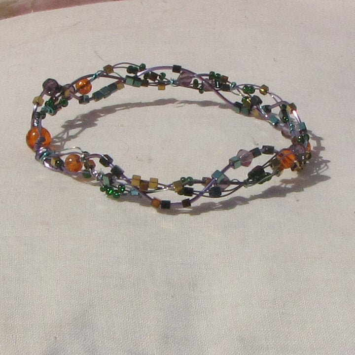 Purple and sea-green coloured copper plaited bracelet - detail