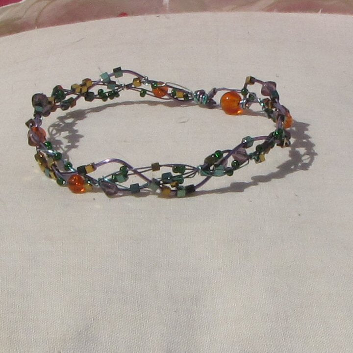 Purple and sea-green coloured copper plaited bracelet - detail