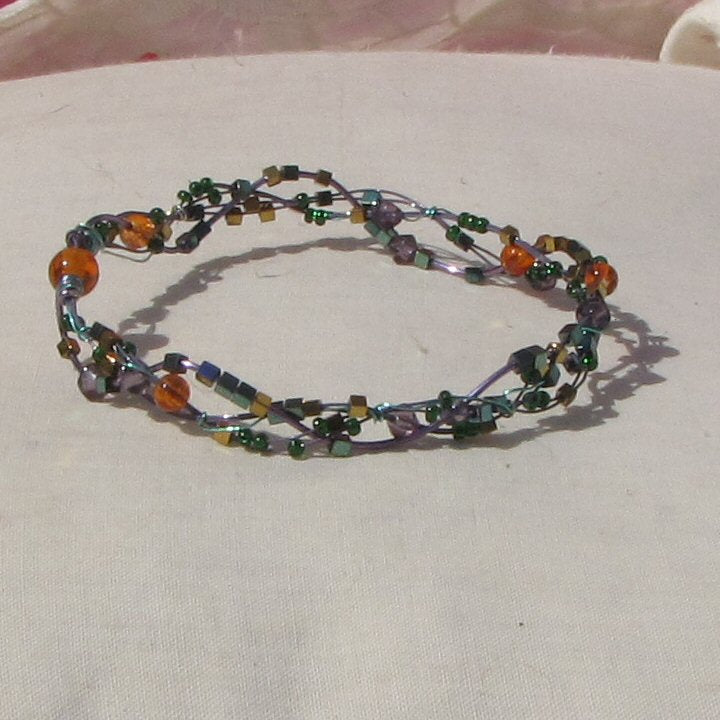 Purple and sea-green coloured copper plaited bracelet - detail