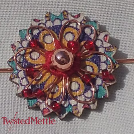 VWB. Central copper bead, copper flower, multiple red beads