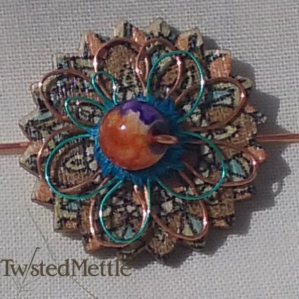 VWB. Purple + orange glass bead, copper + blue coloured copper flowers